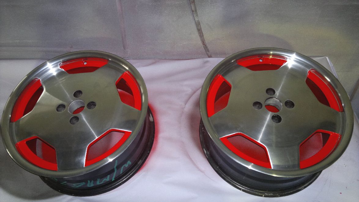Mag wheels refurbished with polished lips and red colour-coded centres