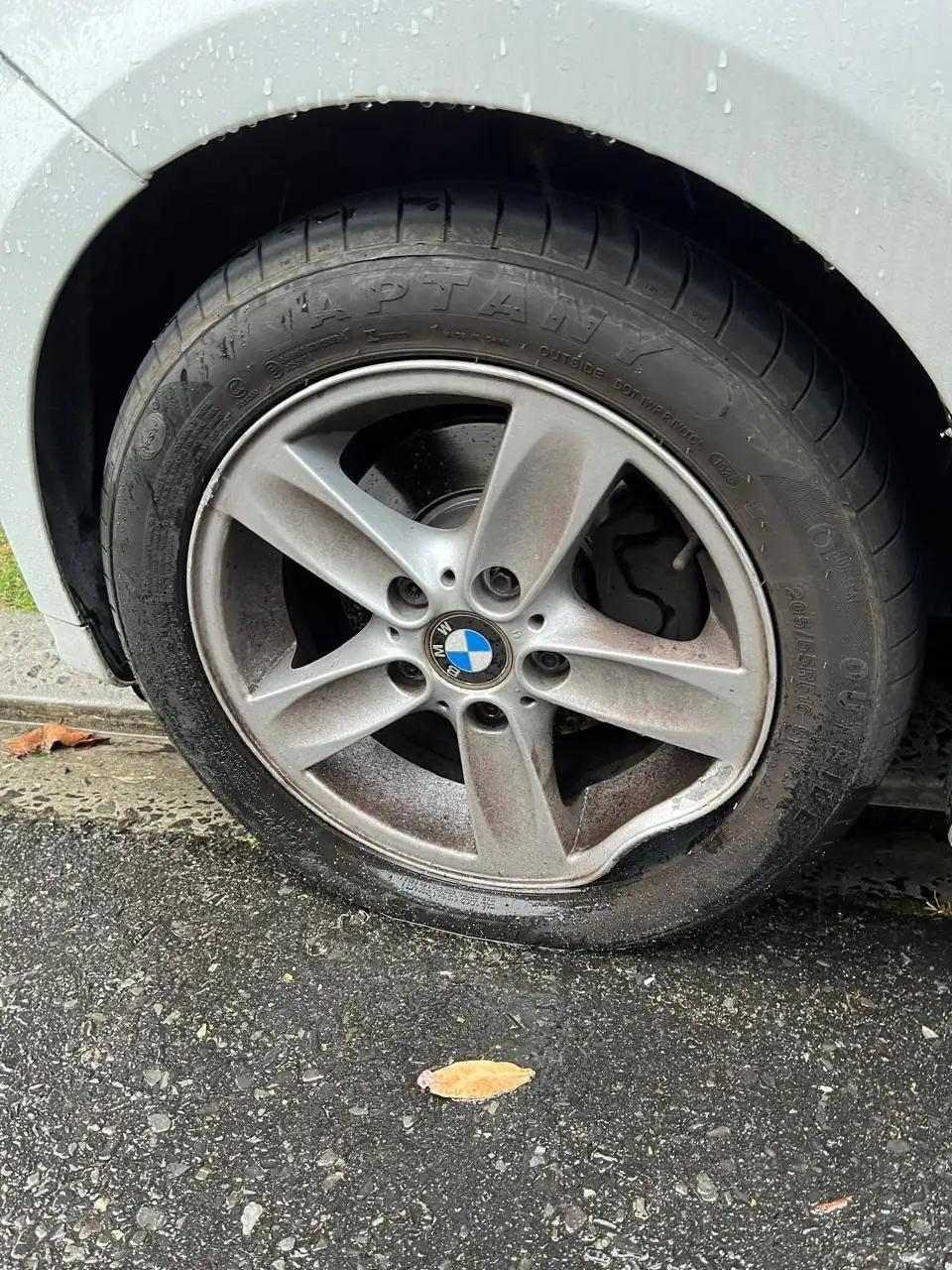 BMW mag wheel with a bent rim before repair