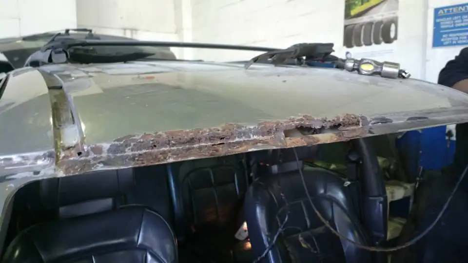 Jeep roof with rust damage before repair