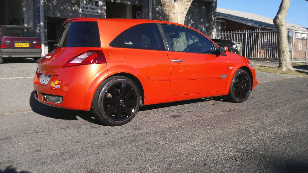 Orange Renault Megane RS with gloss black refurbished wheels